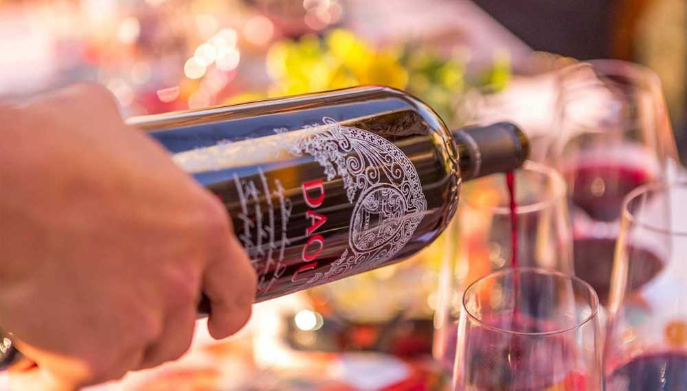 Bottle of Daou red rine being poured